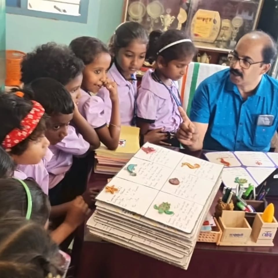 2 volunteers donated ocean-themed clay models created by EY employees to support marine-life learning for 50 students at Govt. High School, Pulikkamali, Kochi.